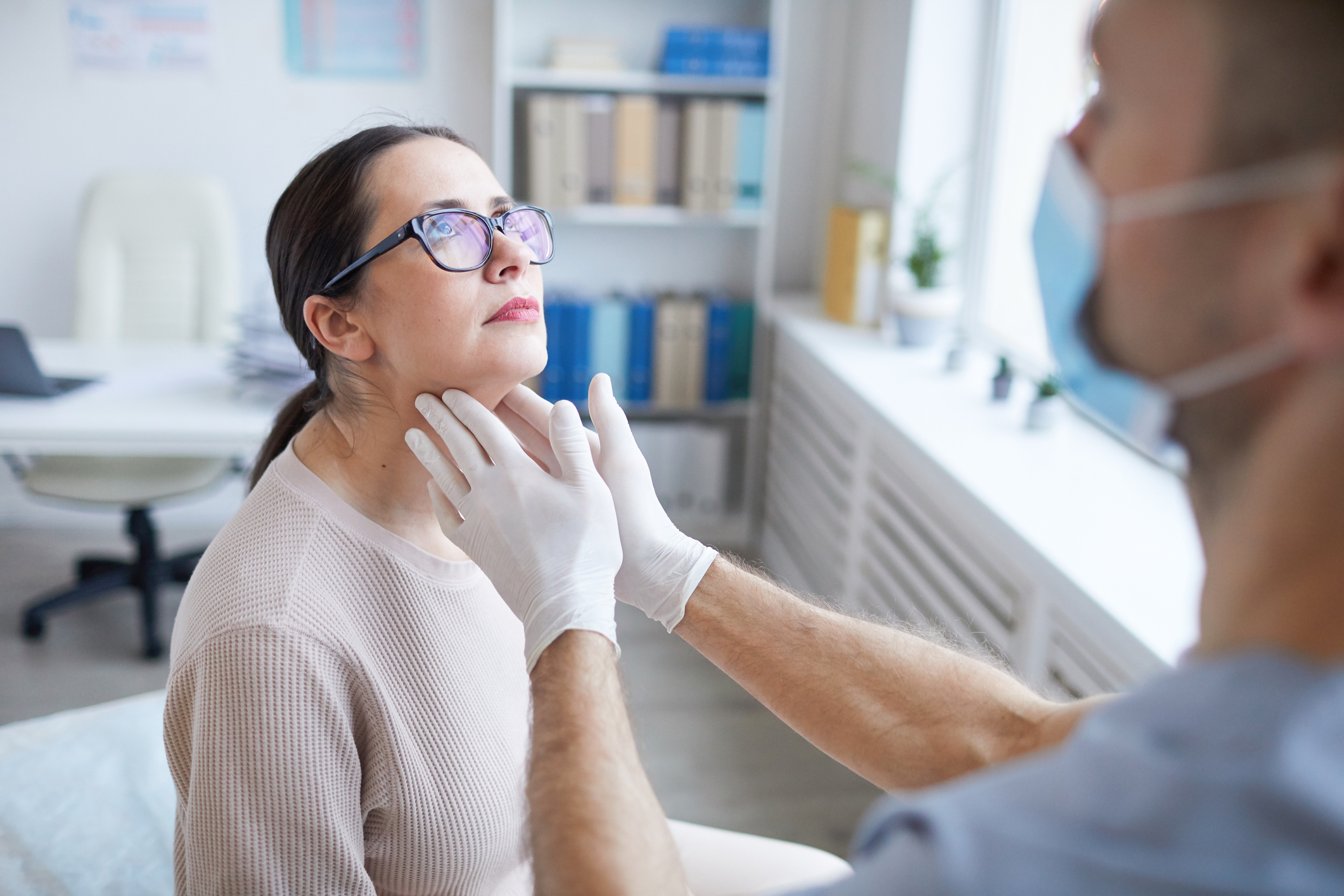 Doctor Examining Woman in Clinic Neck Lift in Bucks County, PA and Hunterdon County, NJ