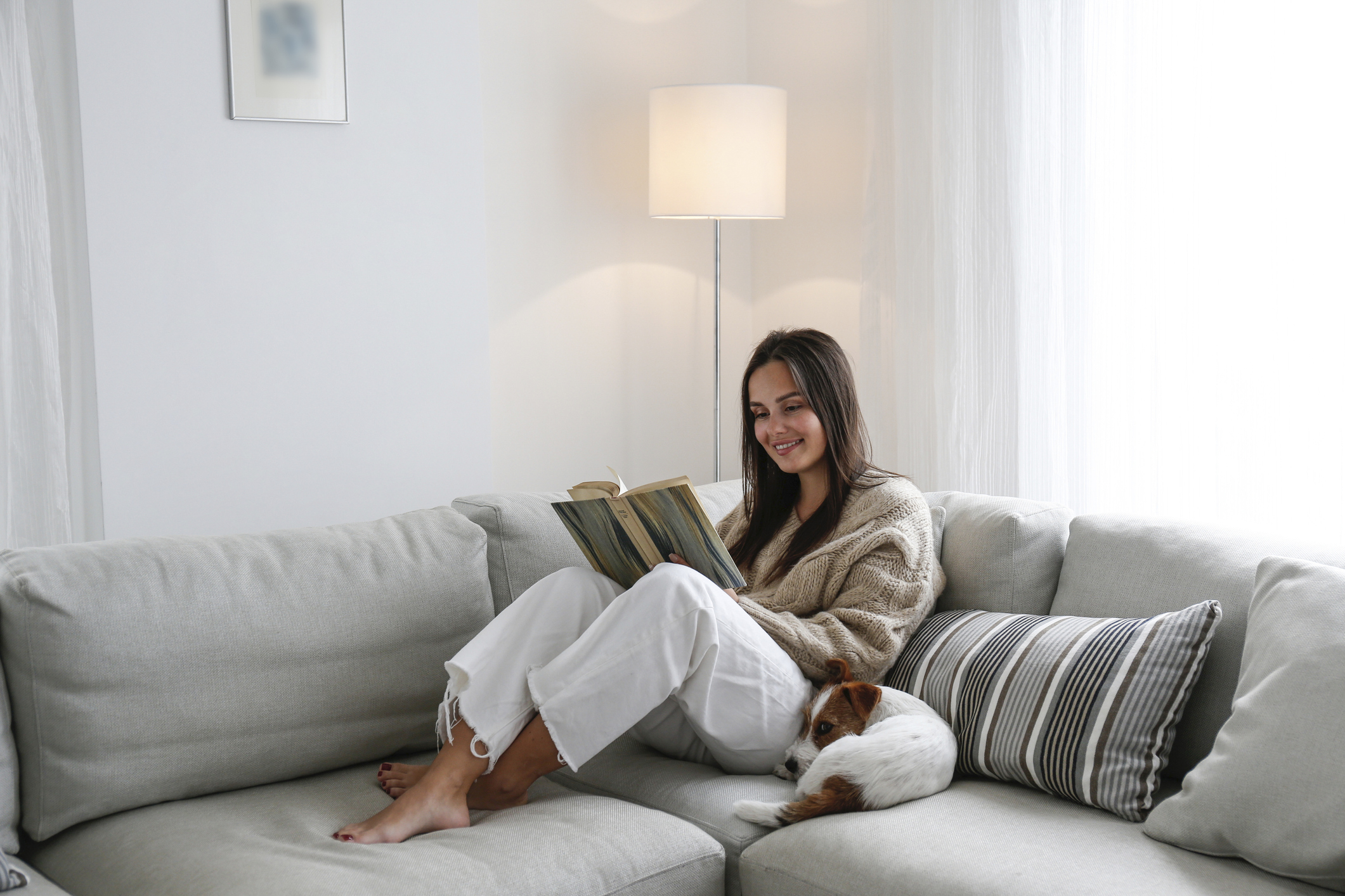 Young woman reading at home