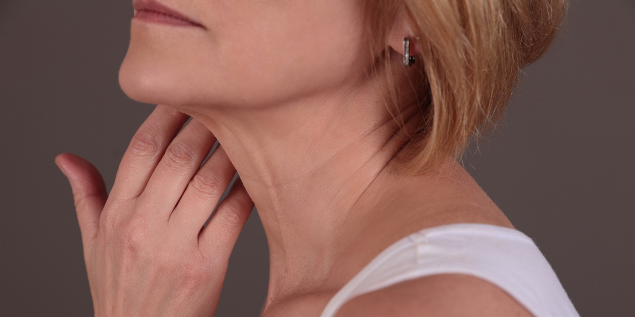 Female neck and shoulders close up. Woman thyroid gland control. Neck Lift in Bucks County, PA and Hunterdon County, NJ